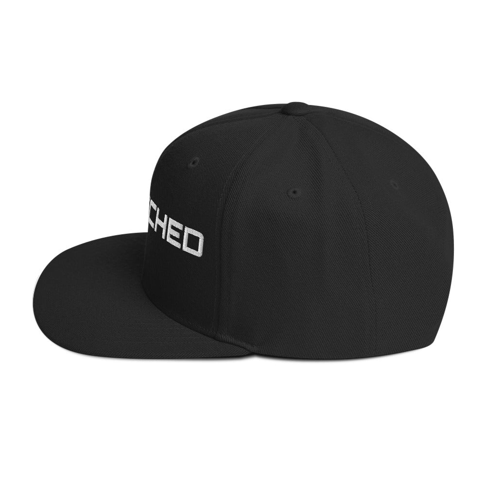 SecNews Patched Embroidered Snapback in Black, left side view, with embroidered green "PATCHED" checkbox design