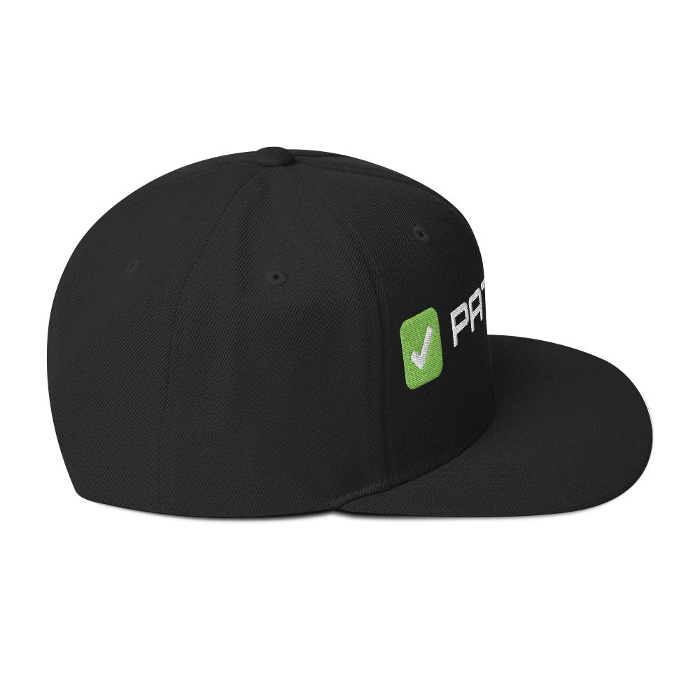 SecNews Patched Embroidered Snapback in Black, right side view, with embroidered green "PATCHED" checkbox design