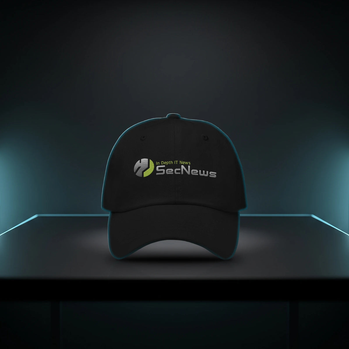 SecNews Cyber dad hat in black with the embroidered SecNews "In Depth IT News" logo, on a dark desk with cyan rim light